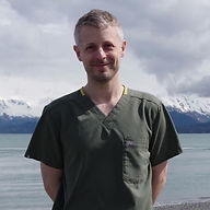Dr. Zack Gardenfors with a dog at Kachemak Bay Animal Hospital