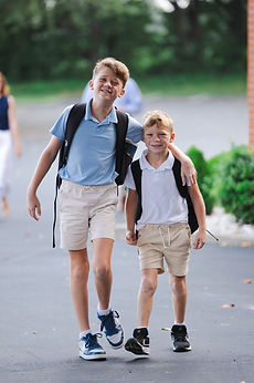 Two brothers walking into school together