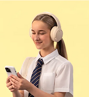 Student with headphones using a phone