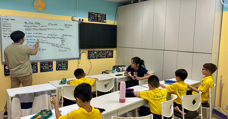 Starlight Centre teacher guiding students in a classroom lesson