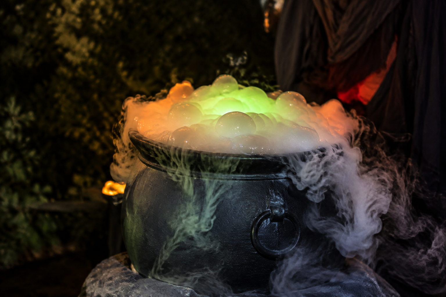 60. Spooky Smoke Bubble Cauldron - backyard Halloween party idea