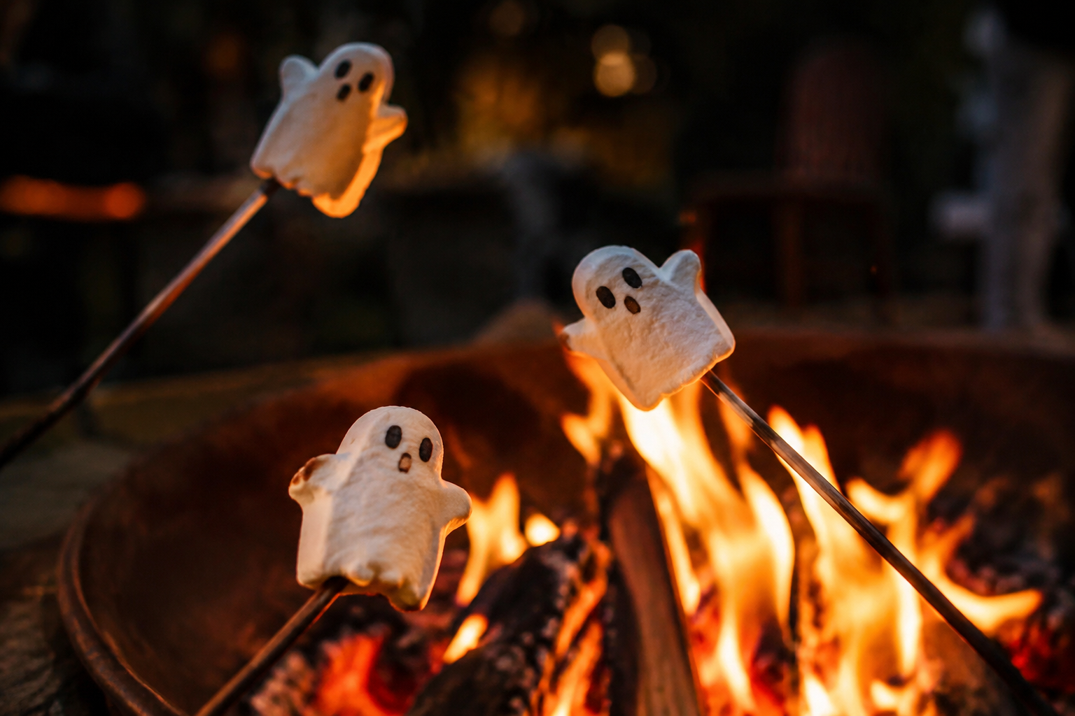 18. Ghost Marshmallow Roasting - backyard Halloween party idea