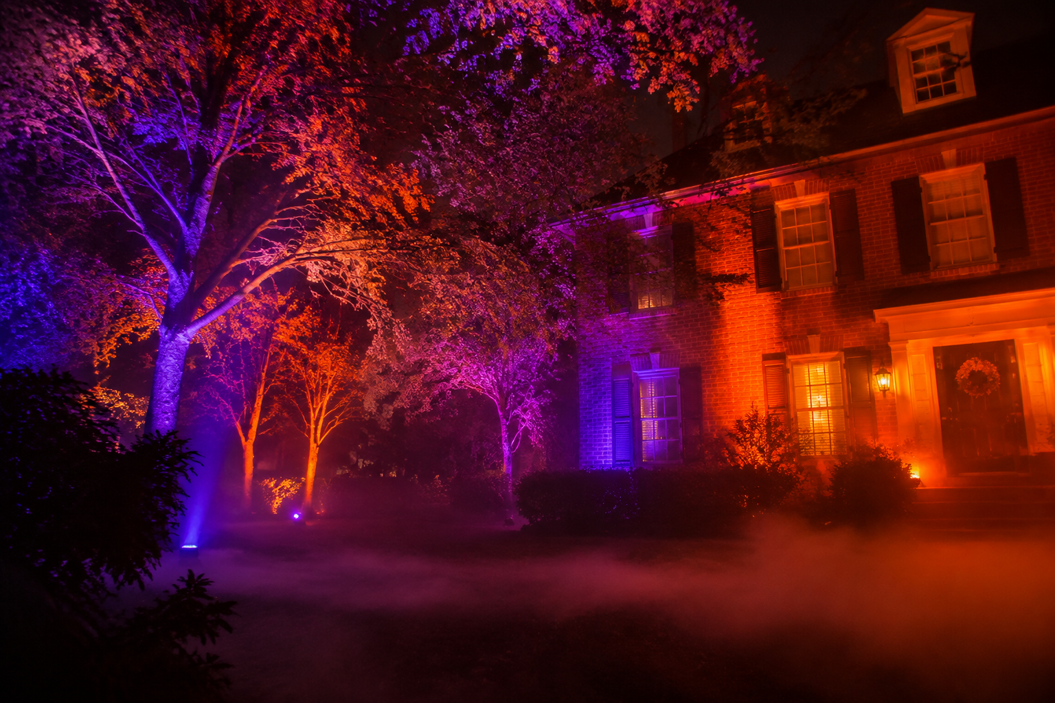 26. Orange & Purple Uplighting - backyard Halloween party idea