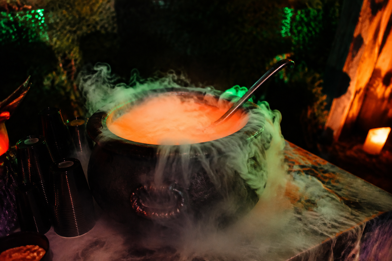 17. Cauldron Punch Bowl Station - backyard Halloween party idea