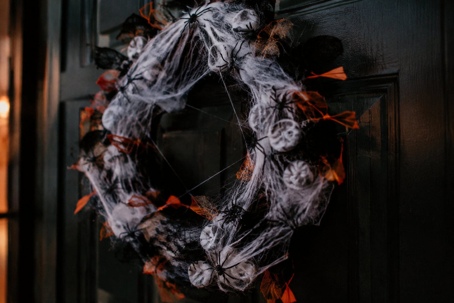 40. Spider Egg Sac Wreath - backyard Halloween party idea