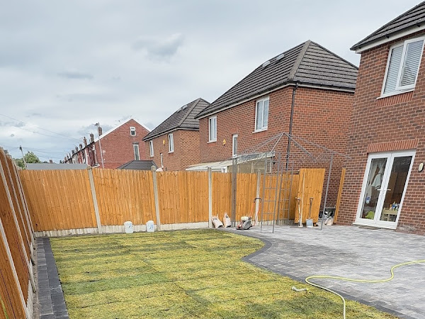Tegula block paving and newly turfed lawn installed by TRUE PAVE UK LTD