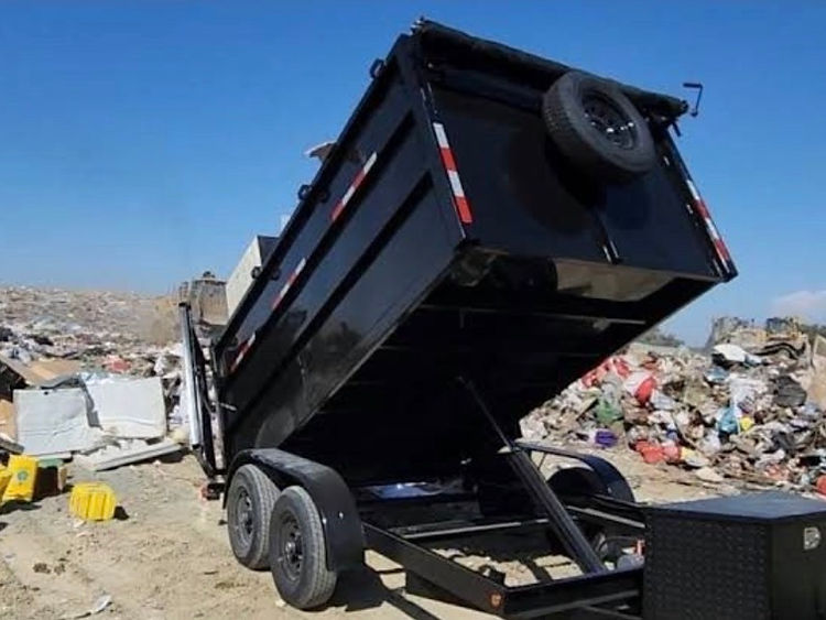 Instant Junk dump trailer hauling a full load of junk and debris