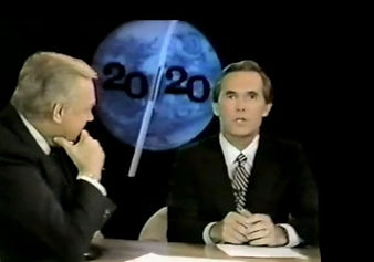 A 20/20 news desk: two anchors on a black set, the programme’s globe graphic between them.