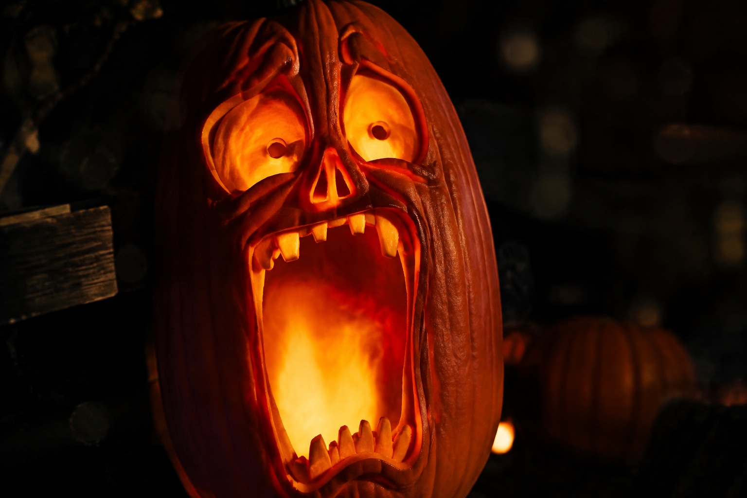 Screaming jack-o-lantern with wide open howling mouth and terrified eyes