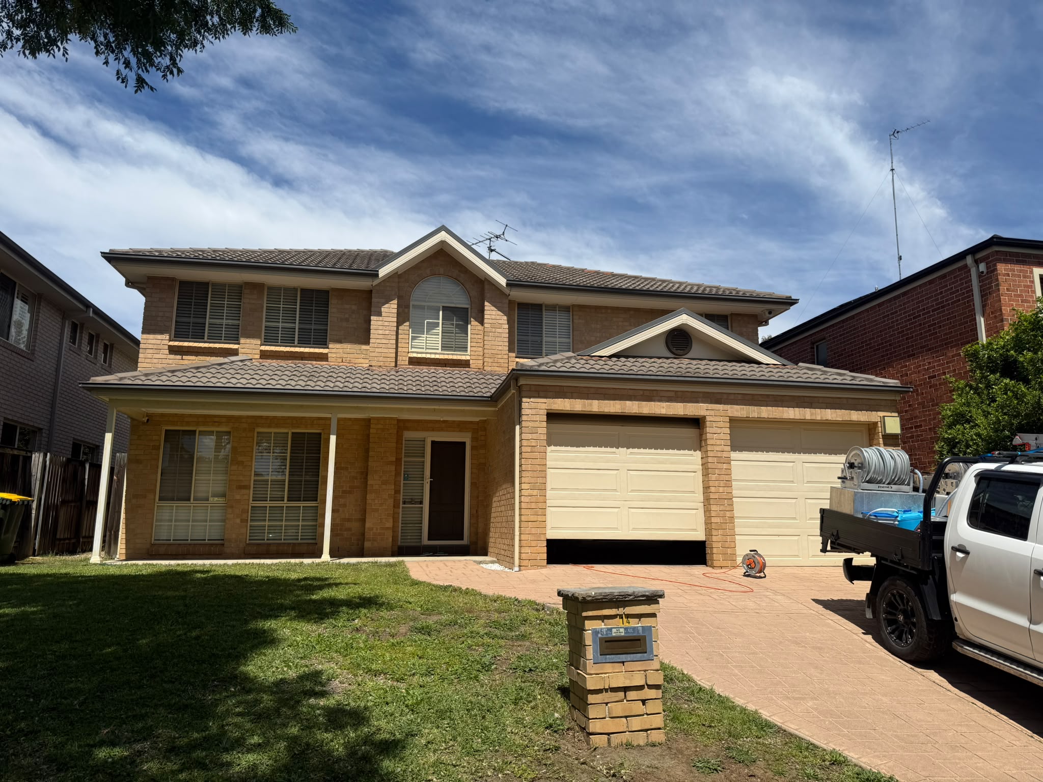 Legacy team finishing a two-storey home exterior clean