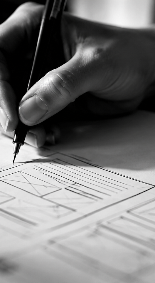 Designer hand sketching wireframe lines