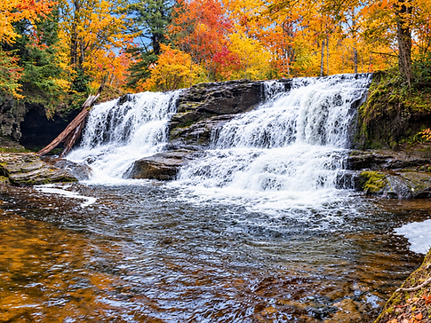 Waterfall on Bear Creek in Pinchot State Forest surrounded by peak fall foliage