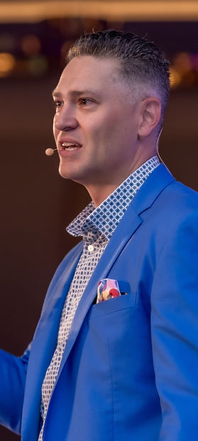 Joe Sallustio gesturing during a keynote