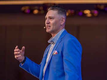 Joe Sallustio gesturing during a keynote