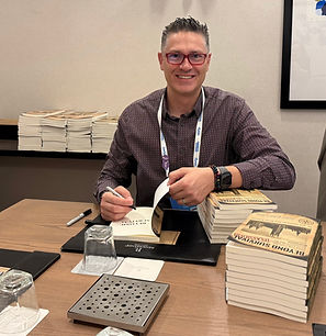 Joe Sallustio signing copies of Beyond Survival