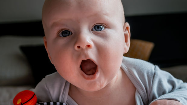 A few cheerful minutes on the tummy, often, builds the strength back-sleeping babies miss.