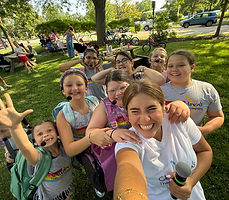 Showstoppers campers and instructor in CTC shirts on an outdoor field day