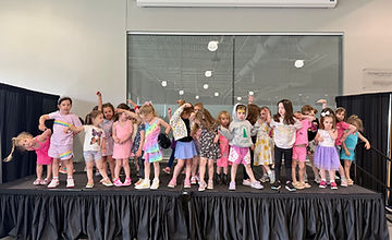 Showstoppers campers gathered on stage for a summer showcase