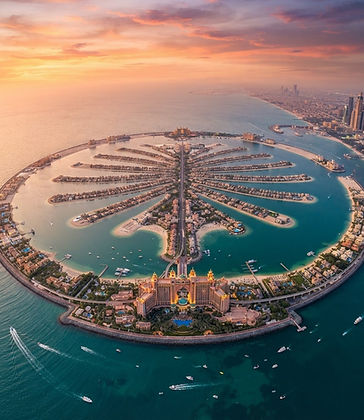 Nieruchomości Palm Jumeirah — widok z lotu ptaka na palma i Atlantis o zachodzie słońca