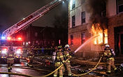 Ground-floor apartment fire on East 24th Street in Minneapolis - overnight fire watch for fire-damaged apartment buildings