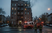Apartment building fire in the Belmont section of the Bronx New York - FDNY response and emergency fire watch services