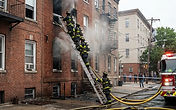Second-floor window rescues at a Moline Illinois apartment fire - firefighter rescue and emergency building security