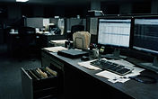 Illustration of an empty government office at night with dark monitors, a security badge on a lanyard and an open filing cabinet drawer