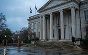 Illustration of a Virginia courthouse exterior at dawn. Editorial illustration, not a photograph of the sentencing.