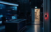 Empty network morning show studio set with cameras and an open doorway behind the anchor desk, illustrating the Today show security breach at 30 Rockefeller Plaza