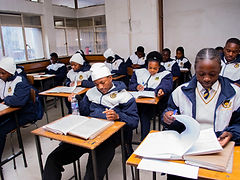 A learner focused on classwork at a private school in Zimbabwe