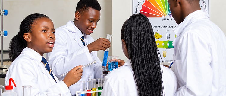 Advent Hope Academy learners performing a chemistry experiment