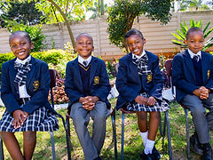 Smiling primary school learners at Advent Hope Academy