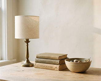 A few carefully kept objects arranged on an oak table