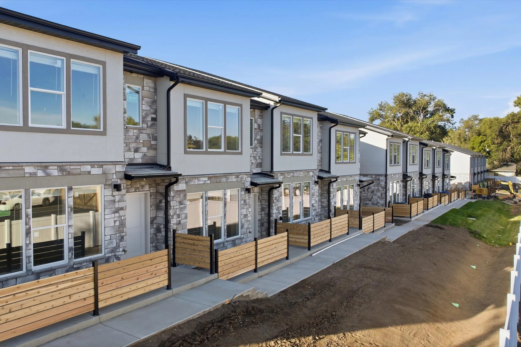 Ogden Towns · Townhome fronts and landscaped walkway