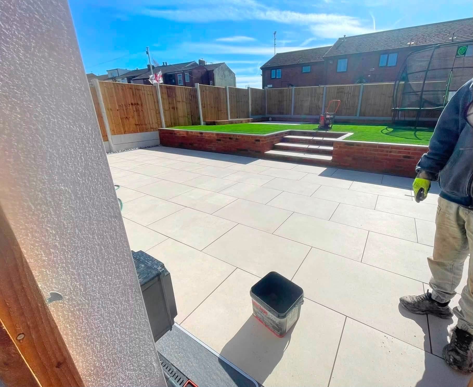 Patio with brick raised planter and steps