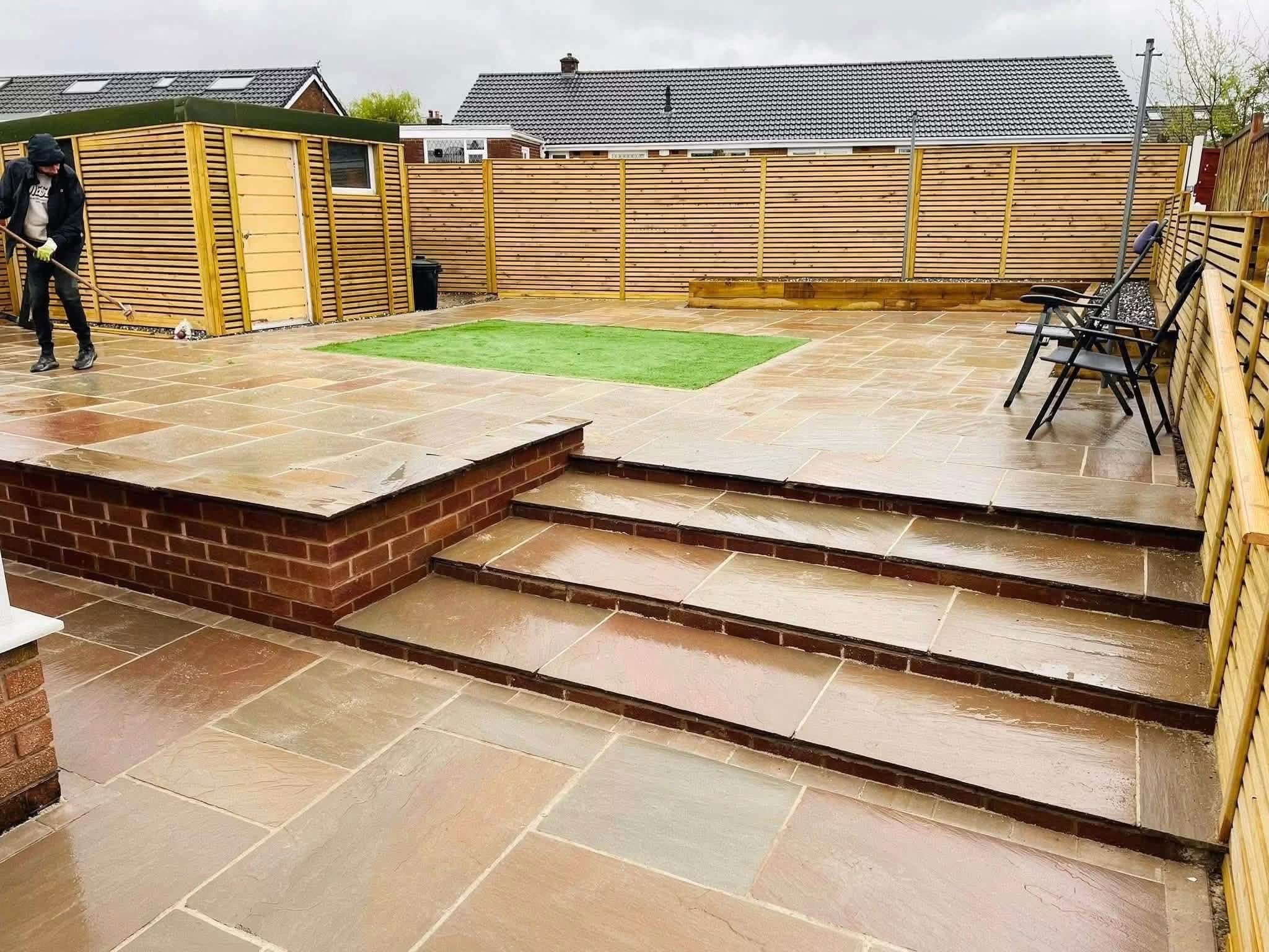 Indian stone patio with steps and raised terrace