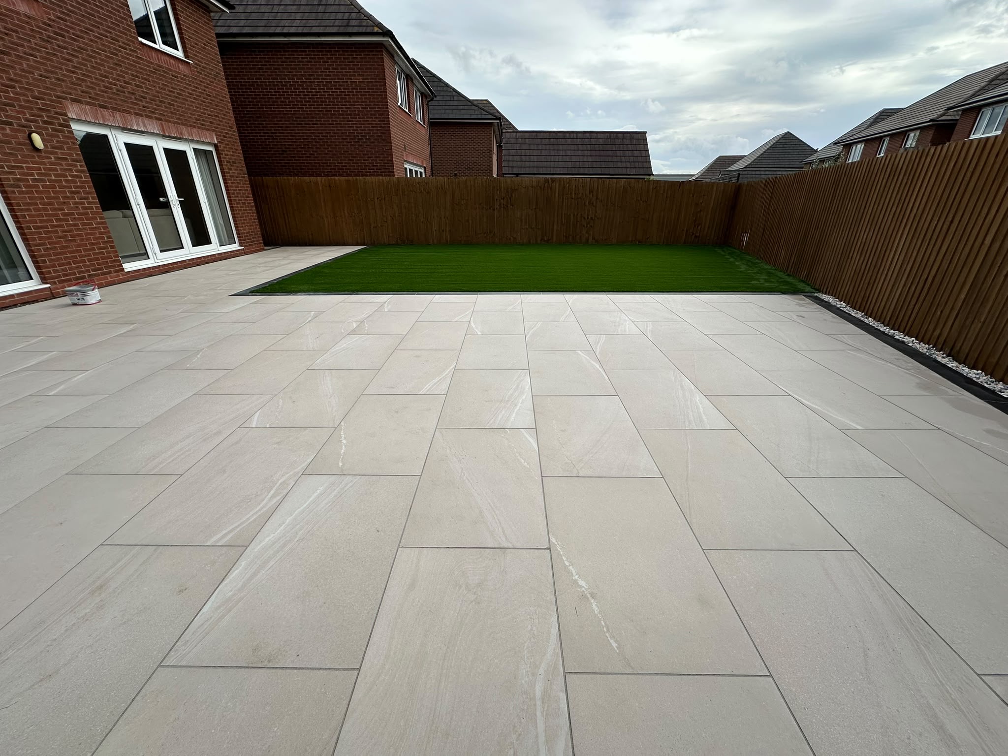 Sand porcelain patio with artificial lawn
