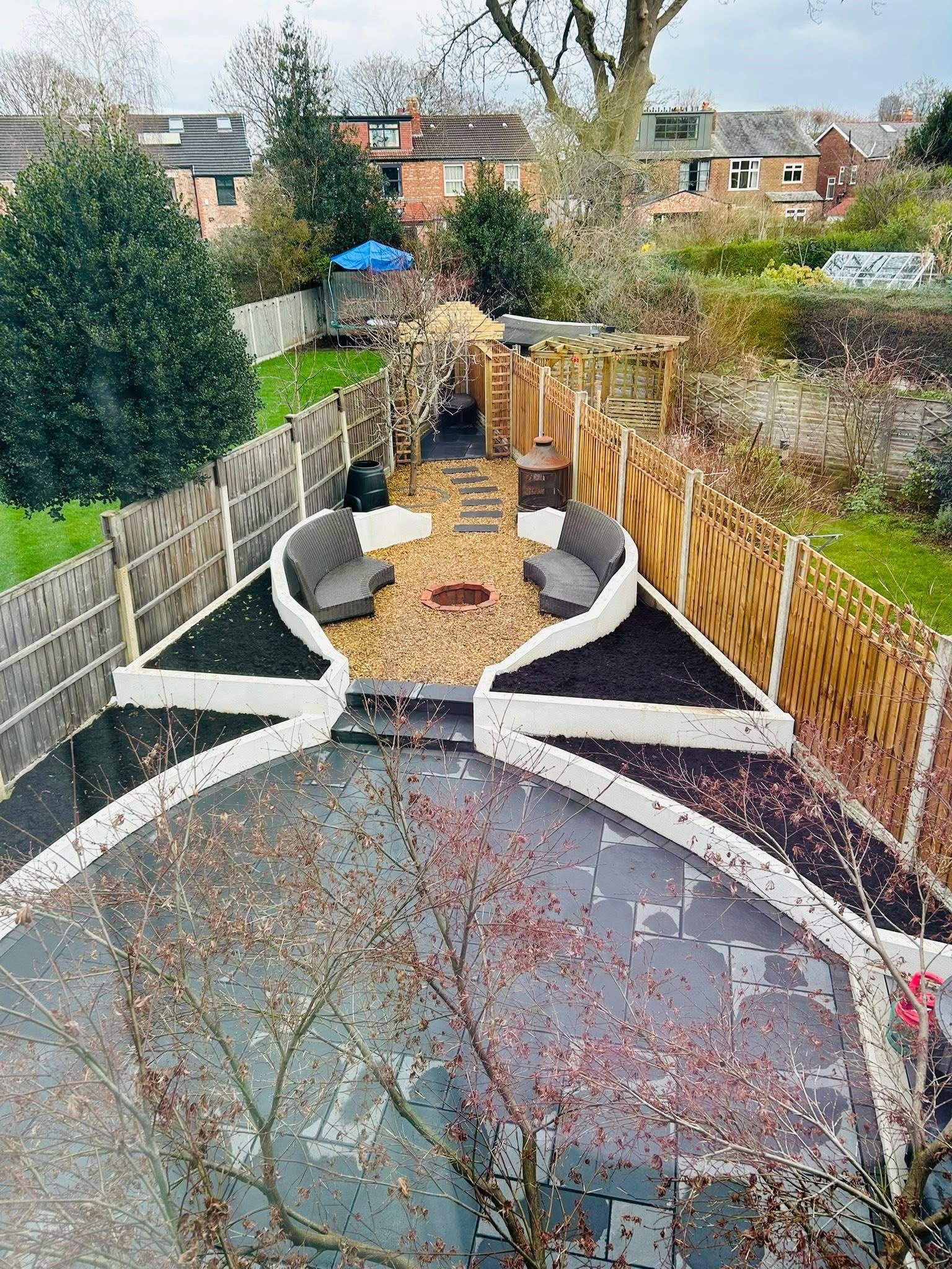 Multi-level slate garden with fire pit seating