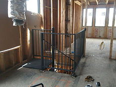 Black steel railing installed during interior framing. Railings by RF Iron Works