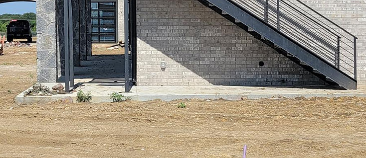 Structural steel exterior stairs with black handrails fabricated by RF Iron Works