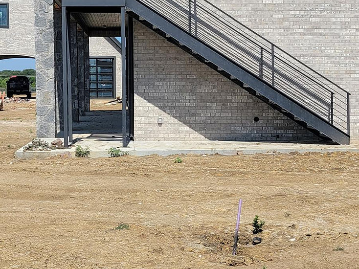 Structural steel exterior stairs with black handrails fabricated by RF Iron Works