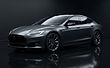 Illustrative render of a dark grey electric luxury fastback sedan in a dark studio