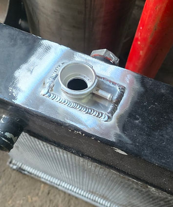 Radiator filler neck weld