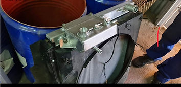 Header tank with filler fittings