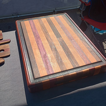 A stripe board with its serving utensils, cut from the same stock.