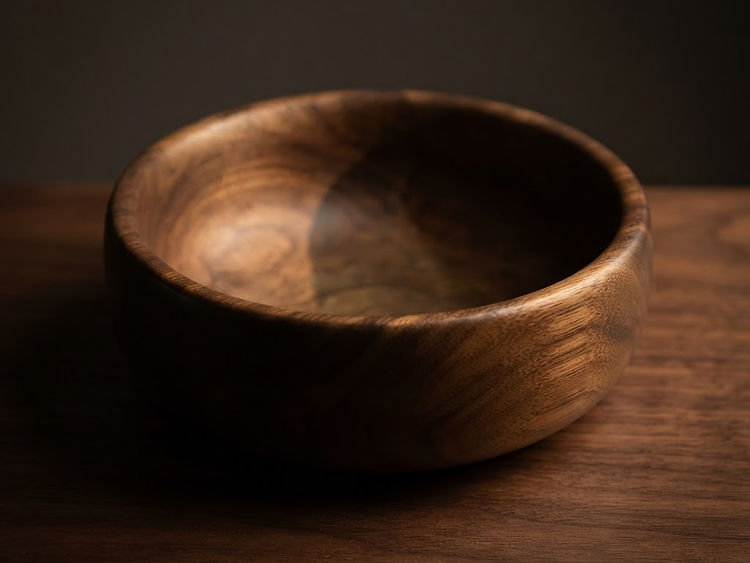 A turned bowl in solid cherry, oiled and waxed.