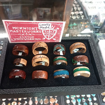 Twelve in the display box at a show, with the card that sits beside them.