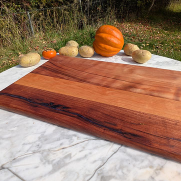 Edge grain walnut with a darkened, framed border.