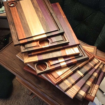 End grain boards stacked, the strip patterns reading along the edges.