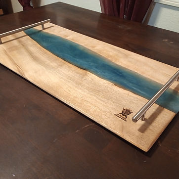 Live edge river board — a mica-tinted pour with creek stone set through it.